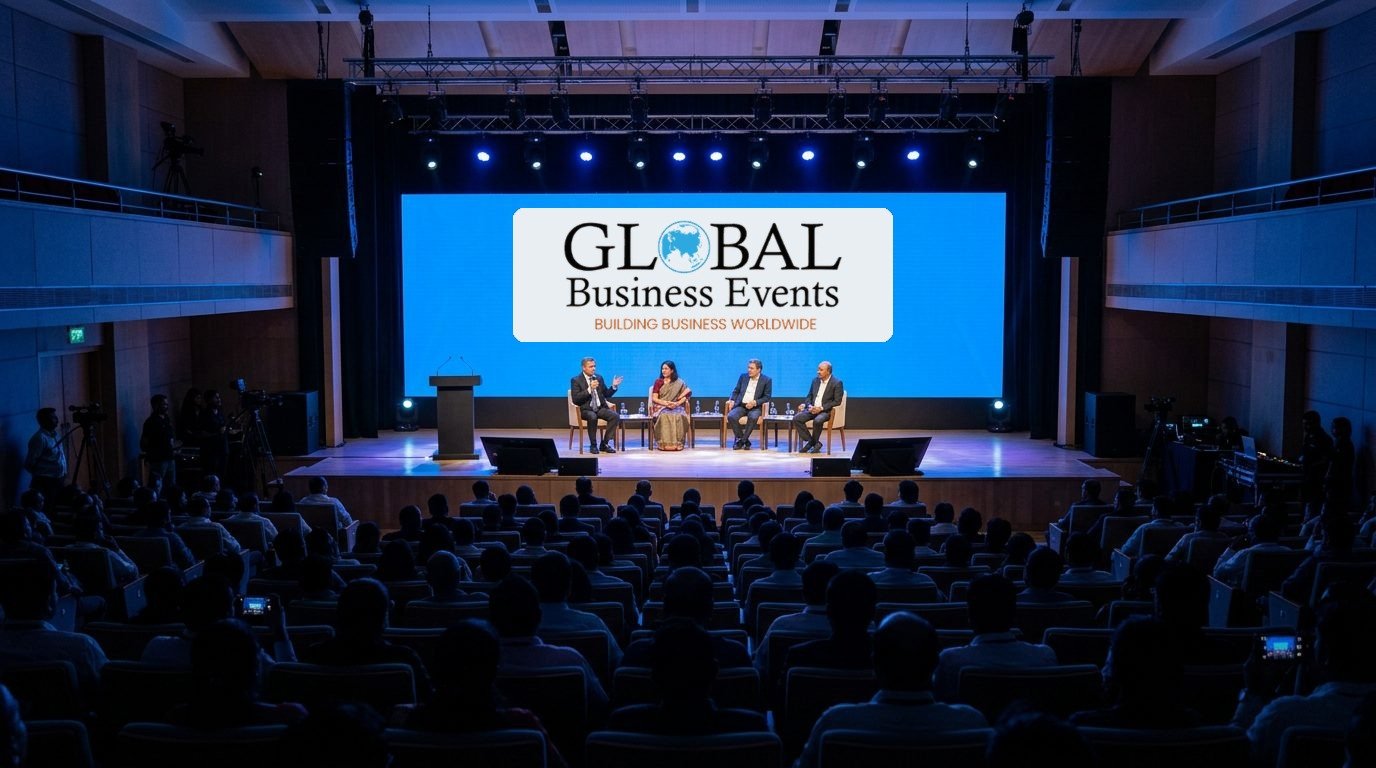 Conference panel on stage with the Global Business Events logo on the backdrop